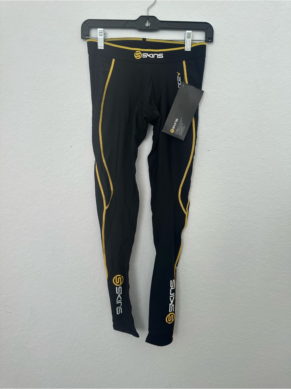 Skins Men's Compression Athletic Tights in Black with Gold Trim